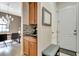 Hallway features a small coffee bar and a bench by the entry door at 8439 Prestbury Dr, Orlando, FL 32832