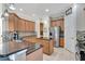 Spacious kitchen features stainless steel appliances, granite countertops, and an eat-in kitchen island at 8439 Prestbury Dr, Orlando, FL 32832