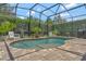 Beautiful screened in pool with brick patio and well maintained landscaping at 8439 Prestbury Dr, Orlando, FL 32832