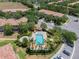 Community pool with multiple buildings, green spaces, and landscaping as well as a lounge area, with plenty of parking at 8439 Prestbury Dr, Orlando, FL 32832