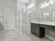 A modern bathroom featuring a glass-enclosed shower, double vanity, and sleek fixtures at 891 Megano Blvd, Deland, FL 32724