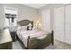 A cozy bedroom with soft lighting, comfortable furnishings, and ample closet space at 891 Megano Blvd, Deland, FL 32724