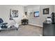 Bright bedroom featuring neutral walls, carpet flooring, and a workout machine near a window at 891 Megano Blvd, Deland, FL 32724