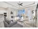 A spacious living room featuring a modern design, tray ceiling and lots of natural light at 891 Megano Blvd, Deland, FL 32724