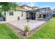 Large backyard featuring a screened-in pool, patio area, and well-maintained landscaping at 9104 Stromboli Ct, Kissimmee, FL 34747