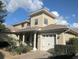 Charming two-story home featuring a barrel tile roof, manicured landscaping, and a brick-paved walkway leading to the entrance at 9104 Stromboli Ct, Kissimmee, FL 34747