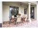 Covered patio featuring an outdoor dining area, perfect for entertaining guests at 9104 Stromboli Ct, Kissimmee, FL 34747