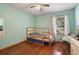 Bedroom featuring a wood frame bunk bed with wood floors and curtains at 1016 Seminole Creek Dr, Oviedo, FL 32765