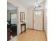 Welcoming foyer with light tile flooring, a decorative front door, and an arched window above the entry at 1016 Seminole Creek Dr, Oviedo, FL 32765