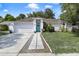 Charming single-story home featuring a bright blue front door, manicured lawn, and an attached two-car garage at 1016 Seminole Creek Dr, Oviedo, FL 32765