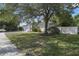 Charming home with a well-manicured front lawn and mature trees offering plenty of shade at 1016 Seminole Creek Dr, Oviedo, FL 32765