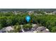 Aerial view of property surrounded by lush greenery, showcasing neighborhood at 10255 Cody Ln, Orlando, FL 32825