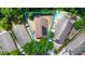 A lovely aerial view showcasing the home's layout, pool, and appealing proximity to lush trees at 10255 Cody Ln, Orlando, FL 32825