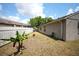 Fenced backyard has lush greenery and plenty of space for outdoor activities at 10255 Cody Ln, Orlando, FL 32825