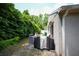 Side yard features lush greenery, grill and peaceful outdoor space at 10255 Cody Ln, Orlando, FL 32825