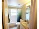 Well-lit bathroom features a shower-tub combo and tiled floors at 10255 Cody Ln, Orlando, FL 32825