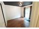 Cozy bedroom with dark ceiling, wood floors, and sliding glass doors to the backyard at 10255 Cody Ln, Orlando, FL 32825