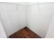 A simple closet featuring wooden floors and wire shelving for optimal storage at 10255 Cody Ln, Orlando, FL 32825