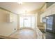 Bright dining area with modern chandelier, a cozy breakfast nook, and ample natural light at 10255 Cody Ln, Orlando, FL 32825