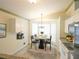 Bright dining area with modern chandelier, a dining table set, and ample natural light at 10255 Cody Ln, Orlando, FL 32825