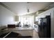 Bright kitchen with granite countertops, white cabinets, and breakfast nook at 10255 Cody Ln, Orlando, FL 32825