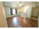 Open floorplan living room featuring hardwood floors that lead to the kitchen at 10255 Cody Ln, Orlando, FL 32825