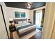 Charming main bedroom featuring a decorative ceiling, hardwood floors, and a comfy king-size bed at 10255 Cody Ln, Orlando, FL 32825