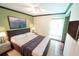 A spacious and comfortable main bedroom offers a king-size bed and hardwood floors at 10255 Cody Ln, Orlando, FL 32825