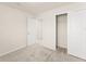 Bedroom featuring a closet, neutral walls and carpet with a doorway to another room at 10959 Vesper Aly, Orlando, FL 32829