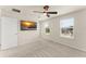 Bright bedroom featuring neutral walls and carpet with a ceiling fan and two windows at 10959 Vesper Aly, Orlando, FL 32829