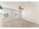 Bedroom featuring neutral walls and carpet with two windows allowing natural light at 10959 Vesper Aly, Orlando, FL 32829