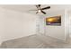 Bedroom featuring neutral walls, carpet, ceiling fan and mounted television at 10959 Vesper Aly, Orlando, FL 32829