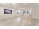 Bright and spacious open-concept living area with tile flooring, stainless appliances, and recessed lighting at 10959 Vesper Aly, Orlando, FL 32829