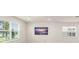 Well-lit living room featuring large windows and contemporary decor at 10959 Vesper Aly, Orlando, FL 32829
