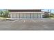 Exterior shot showing well-maintained parking lot with ample spaces in front of a modern community building at 10959 Vesper Aly, Orlando, FL 32829