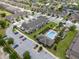 Aerial view of the community featuring townhomes, a pool, and parking at 1109 Pavia Dr, Apopka, FL 32703