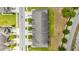 An aerial view of townhomes features well-kept landscaping, driveways, and nearby streets at 1109 Pavia Dr, Apopka, FL 32703