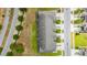 A bird's-eye view of townhomes shows roofs and manicured landscaping with cars parked in driveways at 1109 Pavia Dr, Apopka, FL 32703