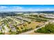 A scenic aerial view captures a sprawling residential neighborhood with homes near highways and businesses at 1109 Pavia Dr, Apopka, FL 32703