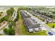 An aerial view showcases a well-maintained residential area with townhomes and lush greenery at 1109 Pavia Dr, Apopka, FL 32703
