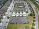 Aerial view of townhome community featuring a pool and playground, surrounded by lush greenery at 1109 Pavia Dr, Apopka, FL 32703
