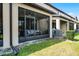 View of the backyard and screened-in patio with outdoor furniture at 1109 Pavia Dr, Apopka, FL 32703
