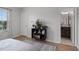 Bedroom showcasing a decorative bookshelf and a doorway leading to the bathroom at 1109 Pavia Dr, Apopka, FL 32703
