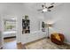 Bedroom with ample storage and a cozy chair, providing a comfortable retreat at 1109 Pavia Dr, Apopka, FL 32703