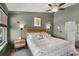 Comfortable bedroom featuring large windows, a ceiling fan, and modern furnishings and decor at 1109 Pavia Dr, Apopka, FL 32703