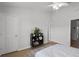 Bedroom features two doors and a decorative bookshelf with neutral walls at 1109 Pavia Dr, Apopka, FL 32703