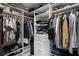 A well-organized walk-in closet with ample shelving and hanging space, creating efficient storage solutions at 1109 Pavia Dr, Apopka, FL 32703