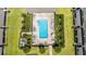 Aerial view of community pool with lounge chairs and a hot tub surrounded by lush landscaping at 1109 Pavia Dr, Apopka, FL 32703