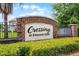 Attractive Crossing at Emerson Park community sign with brick base and manicured hedges at 1109 Pavia Dr, Apopka, FL 32703