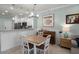 Combined dining and living space with a piano and a table perfect for meals and entertaining at 1109 Pavia Dr, Apopka, FL 32703